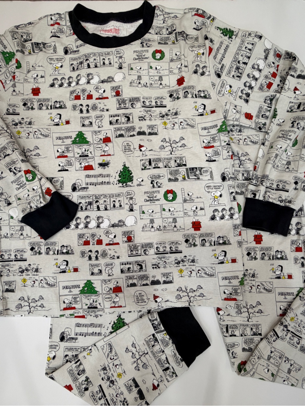 Pottery BarnPeanuts Pajama Set in White with Black Trim and Holiday Accents.